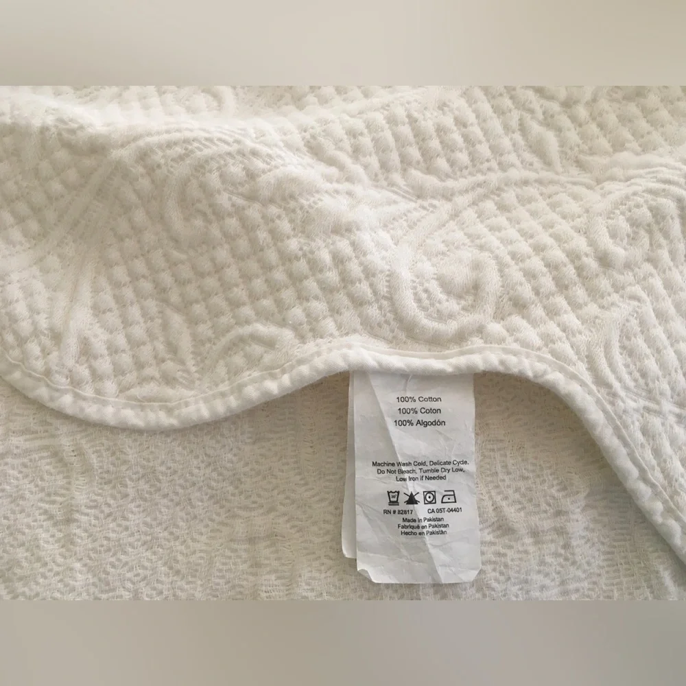 white matelassé coverlet